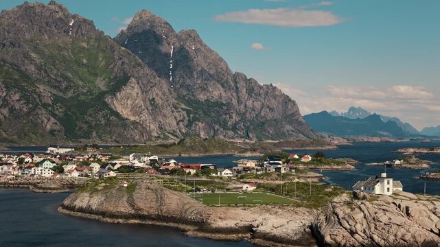 Towering Lofoten mountains dwarf Henningsv&aelig;r football pitch