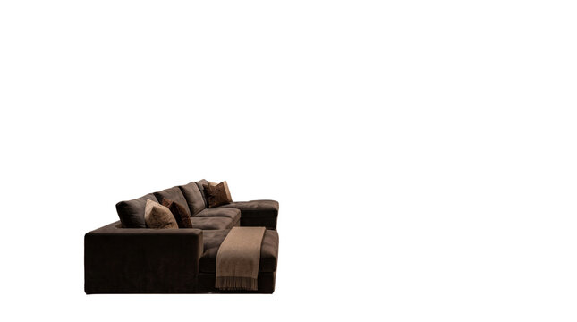 Modern dark brown sectional sofa with decorative pillows. Contemporary fabric couch isolated on white. Comfortable living room furniture.