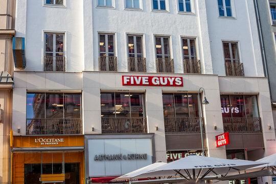 Five Guys Restaurant Facade on the Graben Street in Vienna with L Occitane and Altmann Kuhne Shops. Vienna, Austria - June 21, 2026