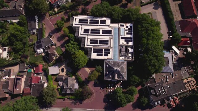 Top down descending aerial view of Dutch town Gorssel, The Netherlands, with MORE museum in the village art center
