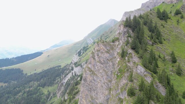 Cinematic aerial drone footage showcasing the spectacular alpine landscape, mountain peaks, green valleys and traditional village of Adelboden in the Bernese Oberland, Switzerland.