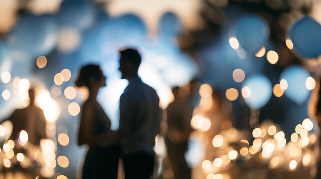 Couple silhouette dancing amid soft blue balloons and warm bokeh lights, celebrating love and a joyful intimate occasion