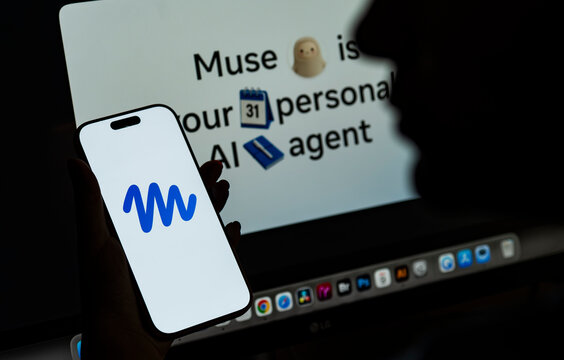 In this photo illustration, a person holds a smartphone displaying the logo of Muse, Meta&rsquo;s personal AI agent.