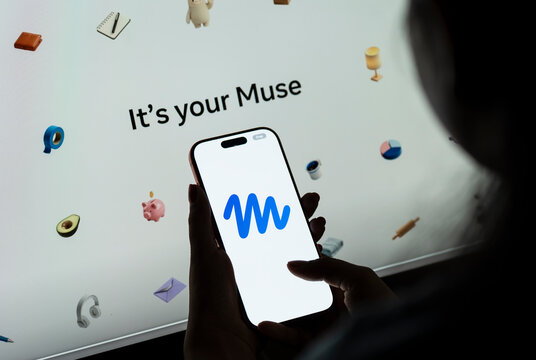 In this photo illustration, a person holds a smartphone displaying the logo of Muse, Meta&rsquo;s personal AI agent.