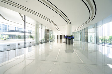 Obraz premium modern office lobby with white marble floor and glass walls