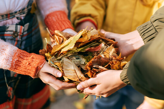 People gather autumn leaves for National Grandparents Day to share with each other in a park setting during fall