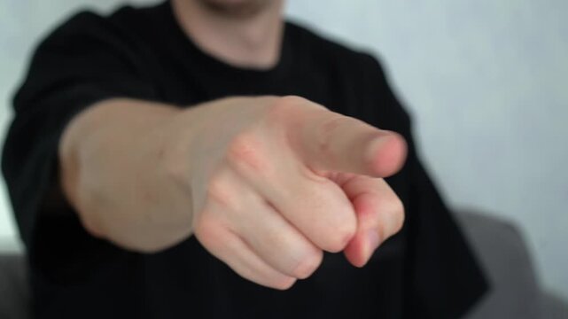 Index finger.
A gesture of mockery and bullying.