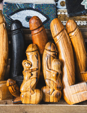 Traditional Balinese Hand-Carved Wooden Phallus Souvenirs and Bottle Openers at Ubud Art Market in Bali Indonesia
