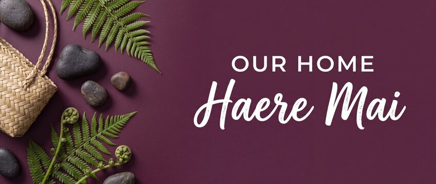 New Zealand Maori welcome background featuring silver fern leaves black stones and woven flax kete basket with Haere Mai text for home interior decor banner design top view flat lay with copy space