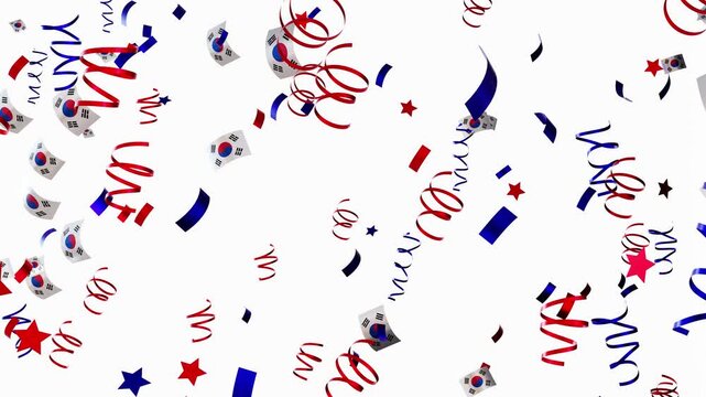 Falling confetti fills the air with South Korean flags and ribbons during a lively celebration at a festive gathering. The colorful display creates a joyful atmosphere
