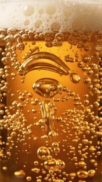 Close up view of refreshing golden beer with rising bubbles and foam. perfect for october festival celebration