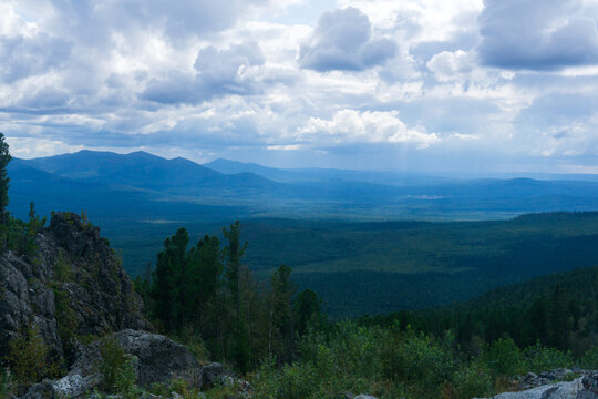 Landscape of mountains in the summer. View from the top of the mountain.