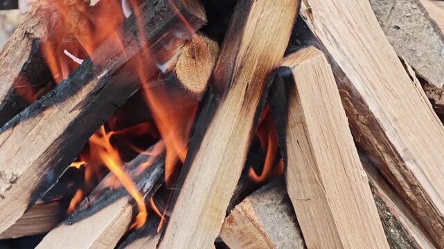 barbecue open fire with chopped wood