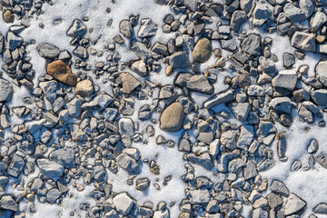 Fresh snow winter outdoor rocks and snow background, backdrop, trail winter texture, cold season backdrop, copy space selective focus bokeh © Stock fresh 