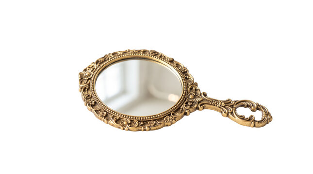 Vintage gold hand mirror with ornate floral frame, antique brass vanity accessory, elegant handheld mirror isolated on white