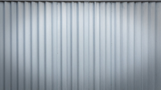 Industrial vertical corrugated metal sheet wall texture