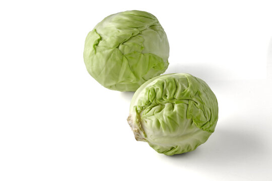 Two Fresh Green Cabbages Isolated on White Background