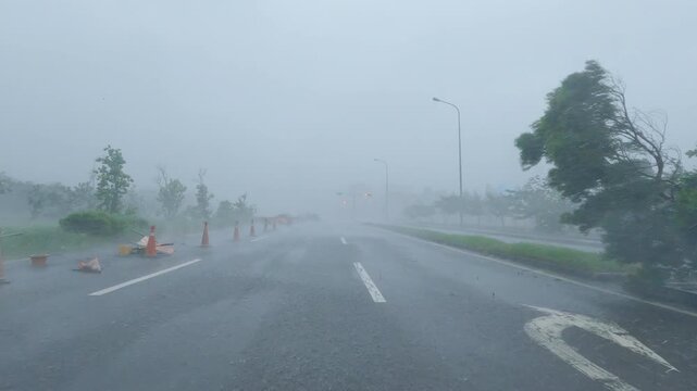 Driving Through Torrential Rain And Powerful Hurricane Winds In City