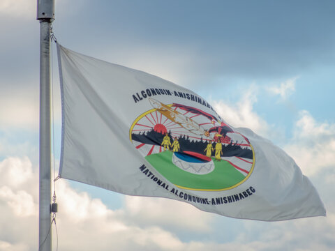 Ottawa, Ontario, Canada. September 9, 2026. Algonquin Anishinabeg Nation flag flying on a flagpole at Ottawa City Hall against a sky.