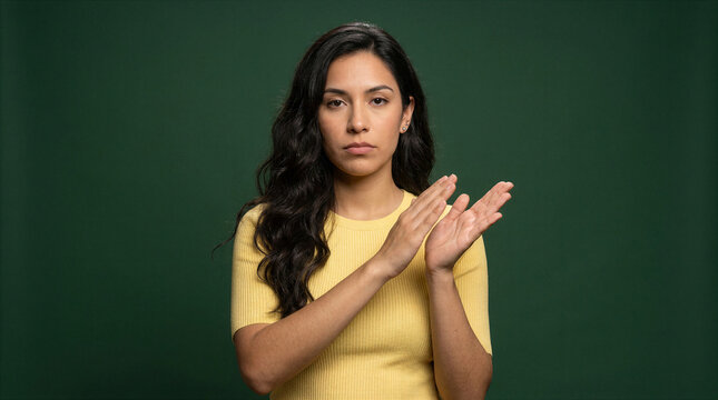 Woman giving an unamused slow clap with a skeptical expression