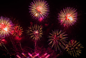Fototapeta premium Purple Firework celebrate anniversary happy new year 2027, 4th of july holiday festival. Purple firework in night time celebrate national holiday. Violet firework Countdown to new year 2026 festival