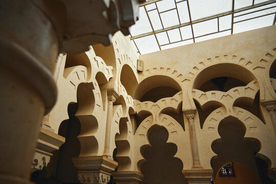 Architectural detail of overlapping Moorish arches inside a Moroccan riad