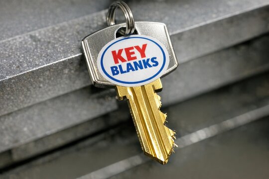 A modern key with no teeth, suitable for decorative purposes or as a symbol of locked secrets