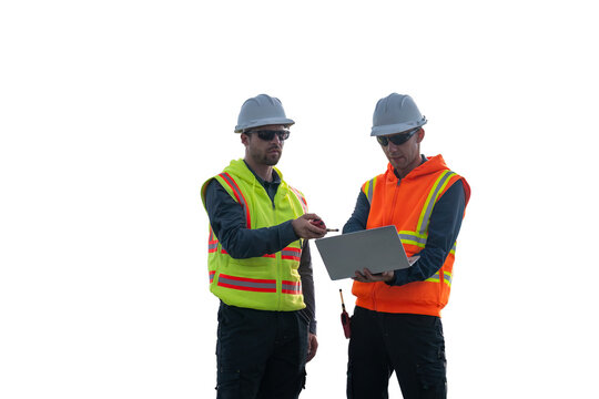 Engineers wearing safety gear, including hard hats examining survey standing industrial facility engaged in a job requires high safety standards concept with PNG white background.