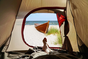 Inside the Tent and look outside – Summer Beach View with Boat and Feet © ExQuisine