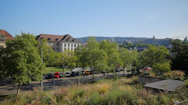 Zurich city park, street traffic and ETH university hill background