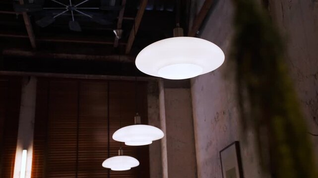 Modern pendant lamps lighting a rustic interior