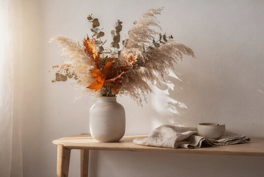 Autumnal Dried Flower Arrangement with Pampas Grass on a Wooden Table