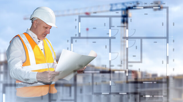 Construction industry. Engineer reviews architectural blueprints at a building site while comparing plans with the future project for construction supervision.