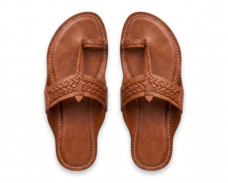 authentic traditional indian cognac brown leather kolhapuri chappals sandals arranged as pair in straight top down overhead view on pure white
