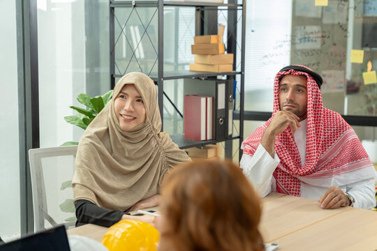 Arab colleagues in a modern office meeting