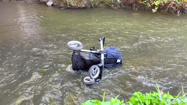 Abandoned Baby Stroller in River &mdash; Child Safety and Environmental Awareness