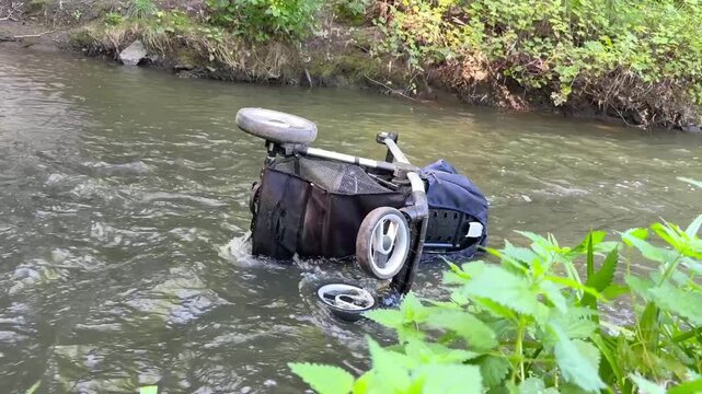 Abandoned Baby Stroller in River &mdash; Child Safety and Environmental Awareness