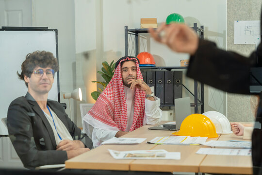 Construction planning meeting with diverse office team