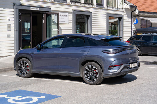 August 17, 2026, Aurlandsvangen, Norway - A blue BYD Seal U electric SUV parked in front of Wangen Apartments
