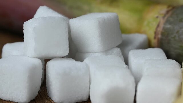 close up of white sugar cubes. sugar cube on the wooden background