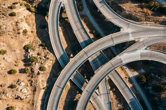 Aerial view of a multi-level motorway interchange &ndash; Ideal for logistics branding, city planning, or transport network content