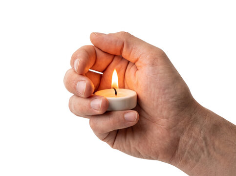Human hand protecting burning candle flame for meditation or peaceful atmosphere.