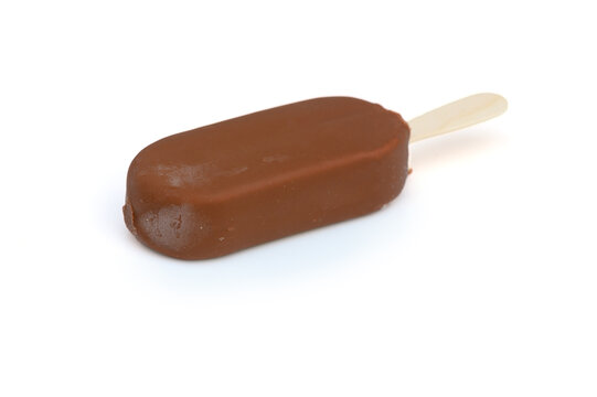 Commercial food photography of a smooth chocolate-enrobed ice cream bar on white