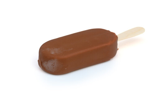 Commercial food photography of a frosted chocolate ice cream bar isolated on white background