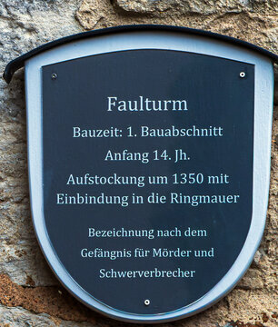 Rothenburg ob der Tauber, Bavaria, Germany-May 25, 2025; Commemorative plaque on the Faulturm (Tower of Sin or Guilt), a historic defensive tower built in the early 14th century. It served as a prison