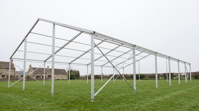 Bare Aluminium Marquee Frame On A Village Green Showing Preparation Before An Event