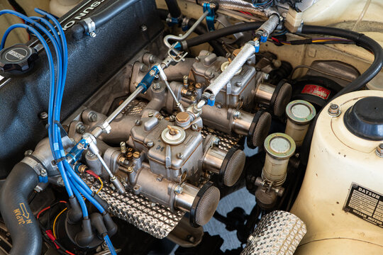 Kemptthal, Zurich, Switzerland, September 6, 2026. High angle shot of vintage Datsun engine bay with carburetors.