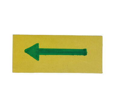 A green arrow pointing left on a rectangular yellow paper background isolated on transparent background