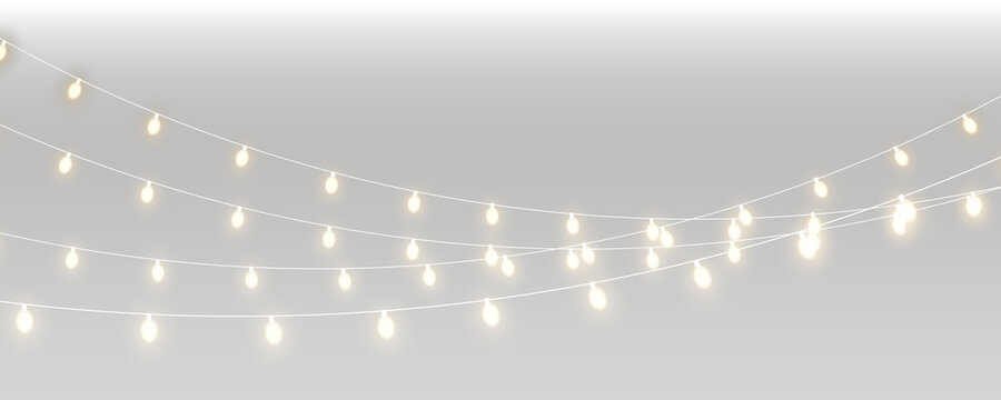 Warm fairy light garlands with glowing bulbs and copy space. Festive string lights for Christmas, wedding and celebration design