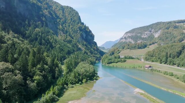 Beautiful Alpine Valley With River and Forest in Switzerland